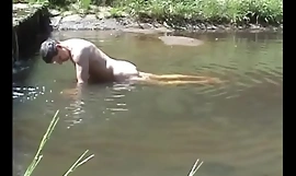 Cumming exceeding a stone close by a river